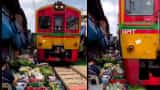 Life Risking Maeklong Railway Market in Thailand food market on railway line where train passes through shops watch video