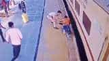 RPF Constable saves men life who is trying to catch train in Dausa Rajasthan Railway Station cctv footage