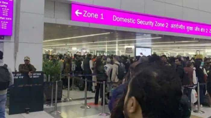 Delhi Airport T3 Congestion DIAL hourly updates passengers sit outside airport check in process travel advisory issued