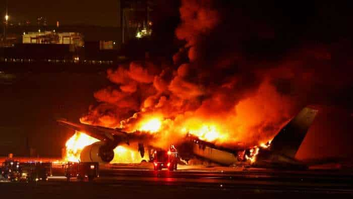 Tokyo airport flight fire accident over 300 flights cancelled after plane collision at Haneda airport