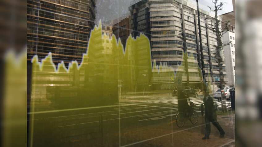 Asia stocks, dollar slip as markets await Fed, BOJ meetings