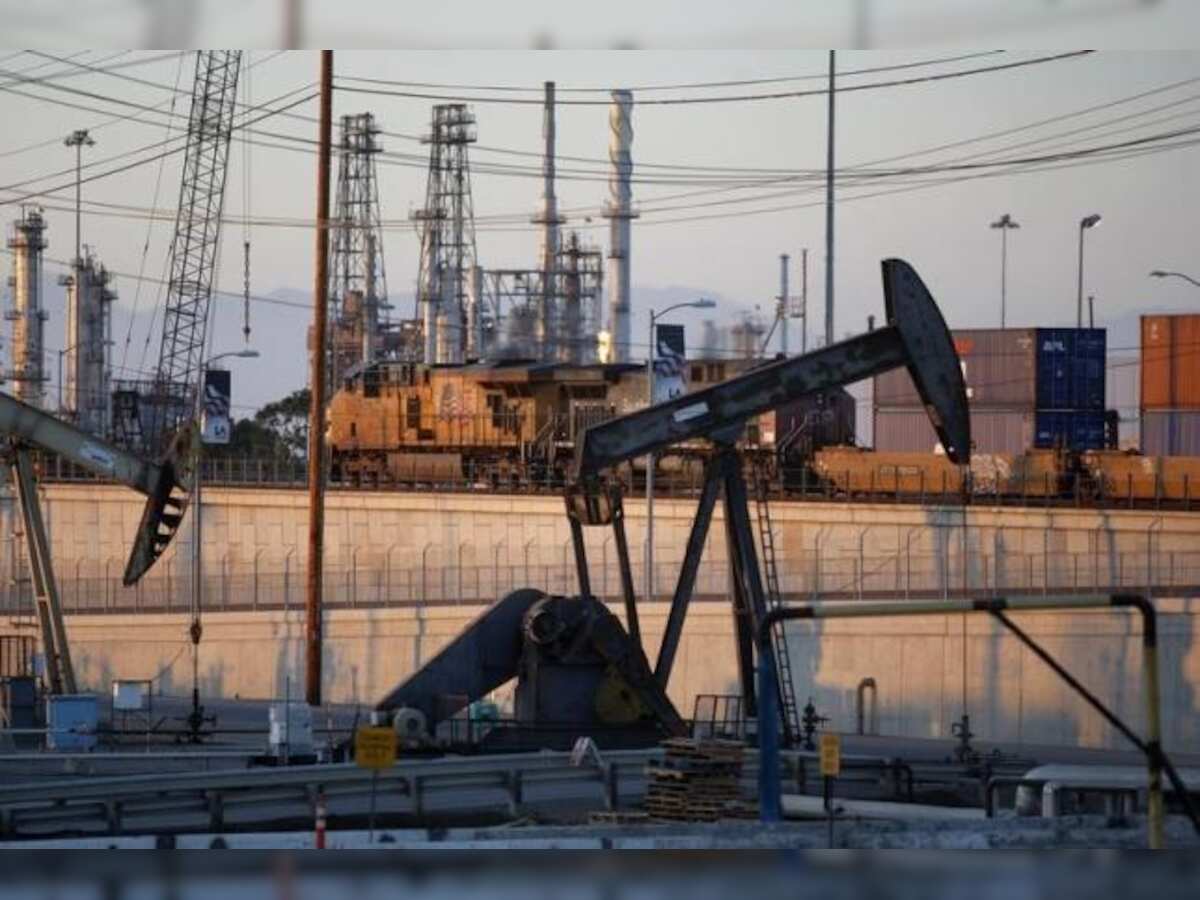 Crude oil futures rise on weaker dollar, new