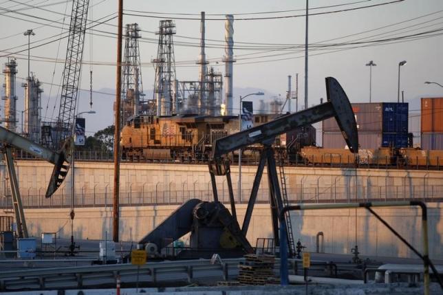 Crude oil futures rise on weaker dollar, new