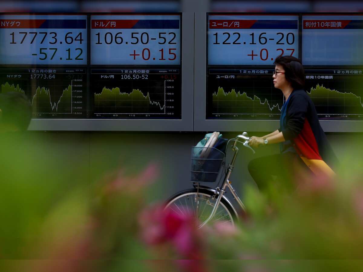 Asian stocks edge down, take cue from Wall