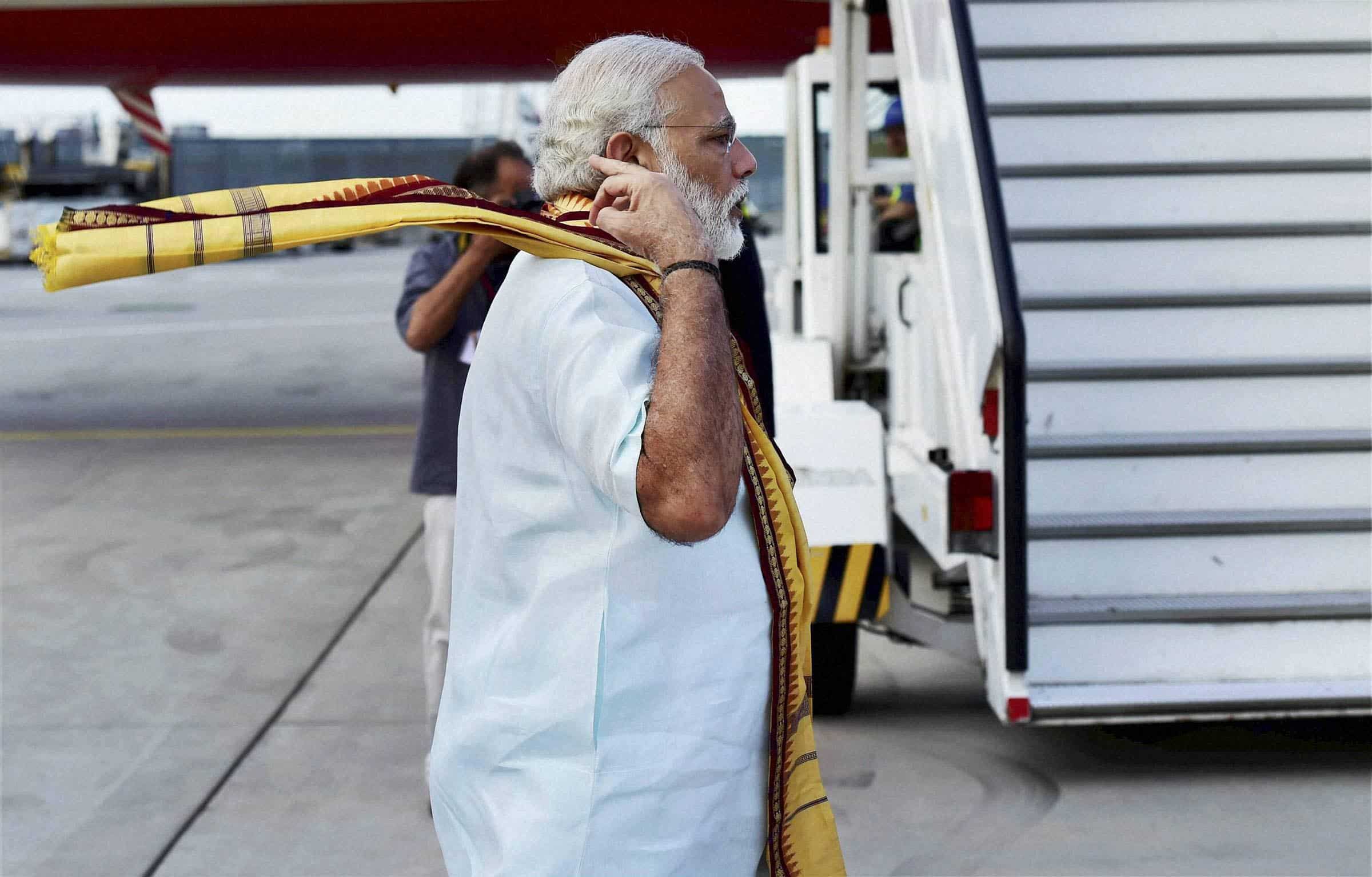 Here we have PM Modi, adjusting his scarf as he departs from Frankfurt on Thursday. PTI