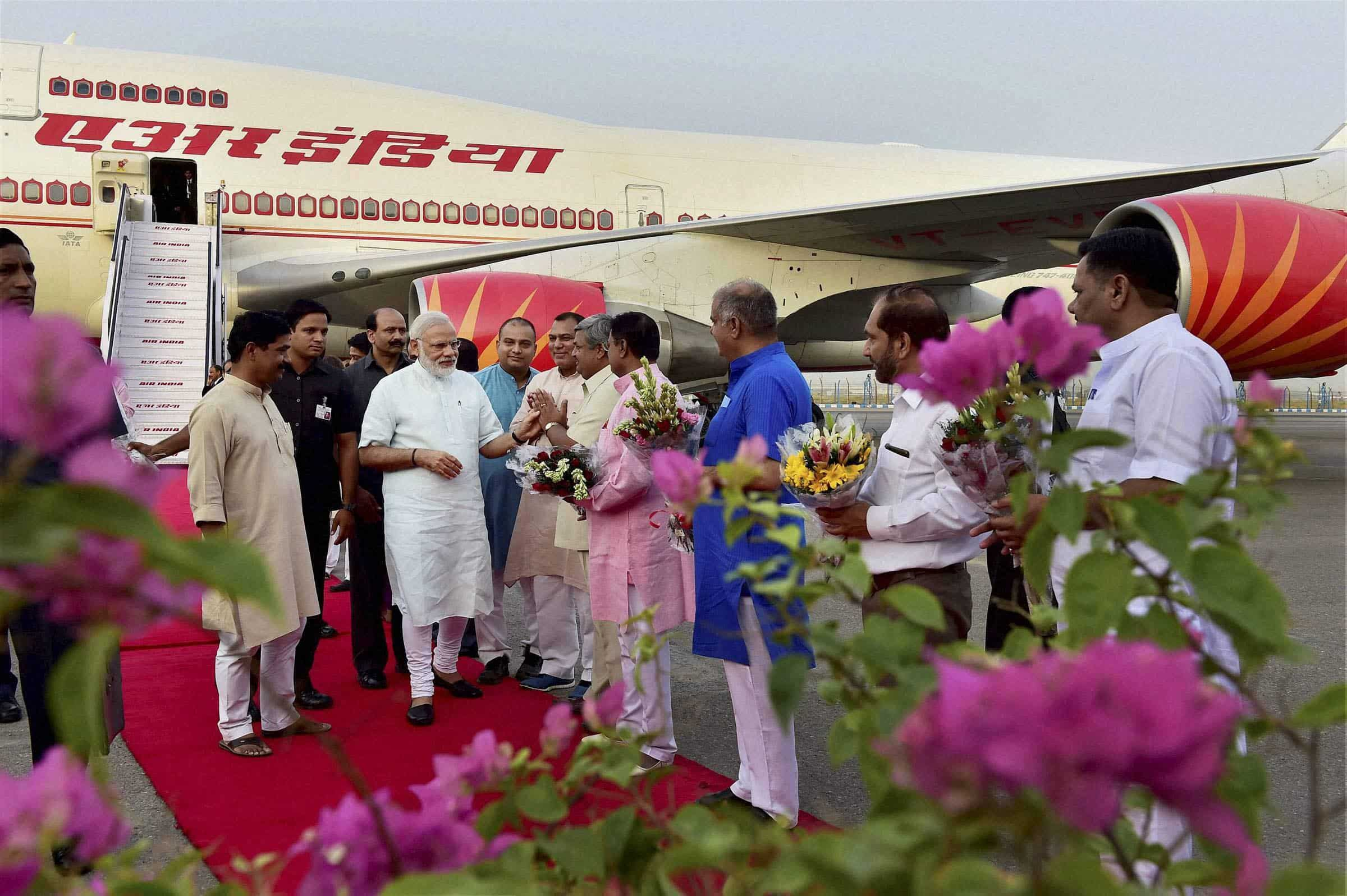 Narendra Modi is greeted by BJP leaders on his arrival at Air Force Station, Palam in New Delhi on Friday. PTI