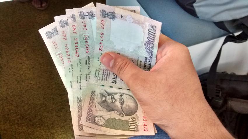 Rupee firms up 14 paise against dollar in early morning trade
