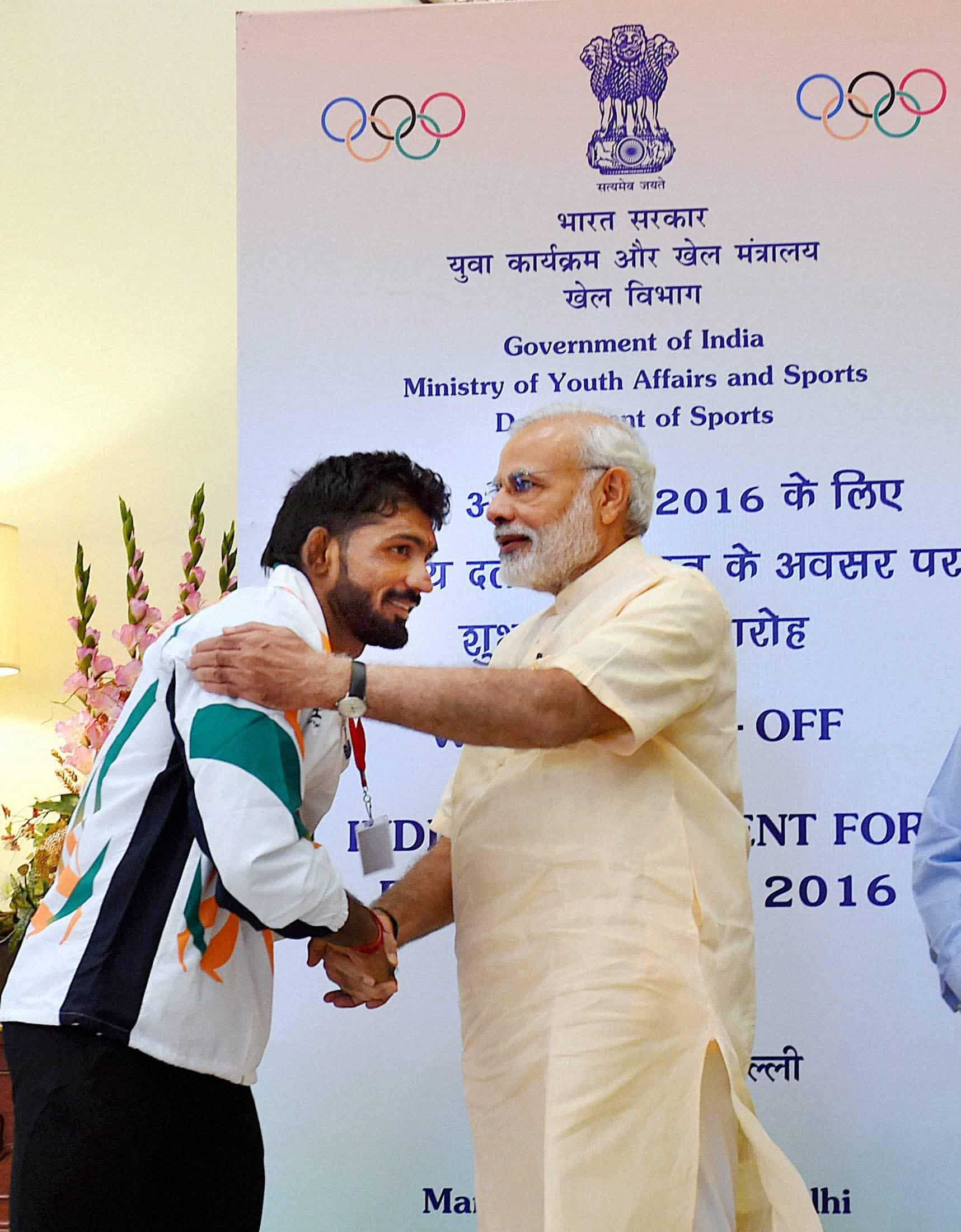 Prime Minister Narendra Modi with Indian wrestler Yogeshwar Dutt at Manekshaw Centre. PTI