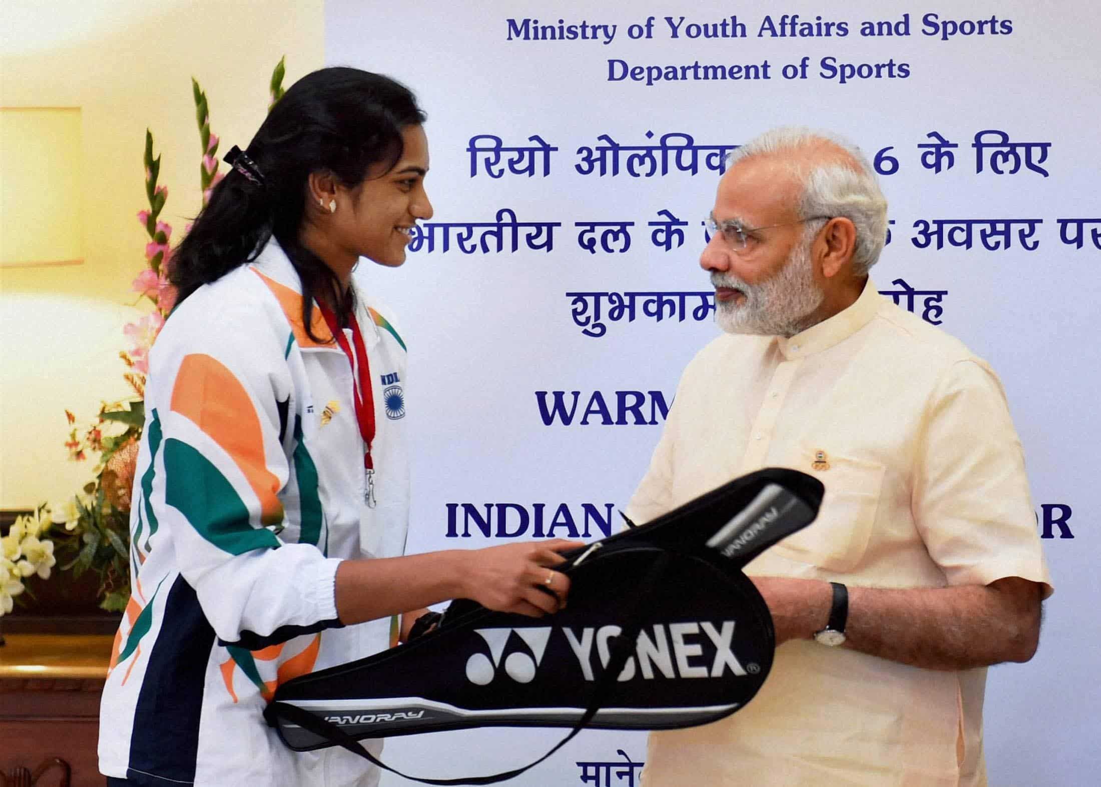 Badminton player, P V Sindhu shakes hands with PM Modi. PTI