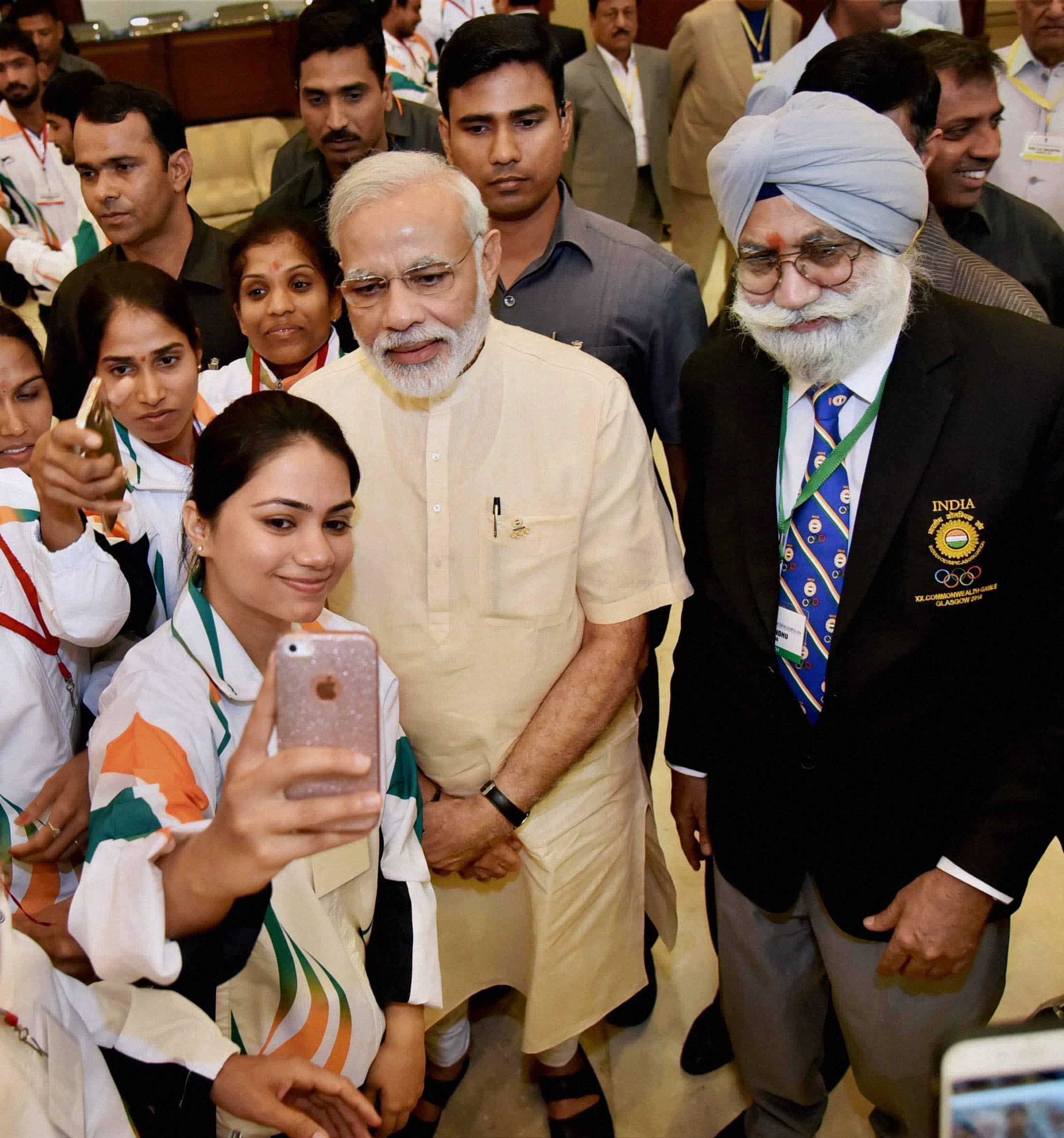 The Indian contingent for Rio Olympics 2016 and PM Narendra Modi in a selfie moment. PTI