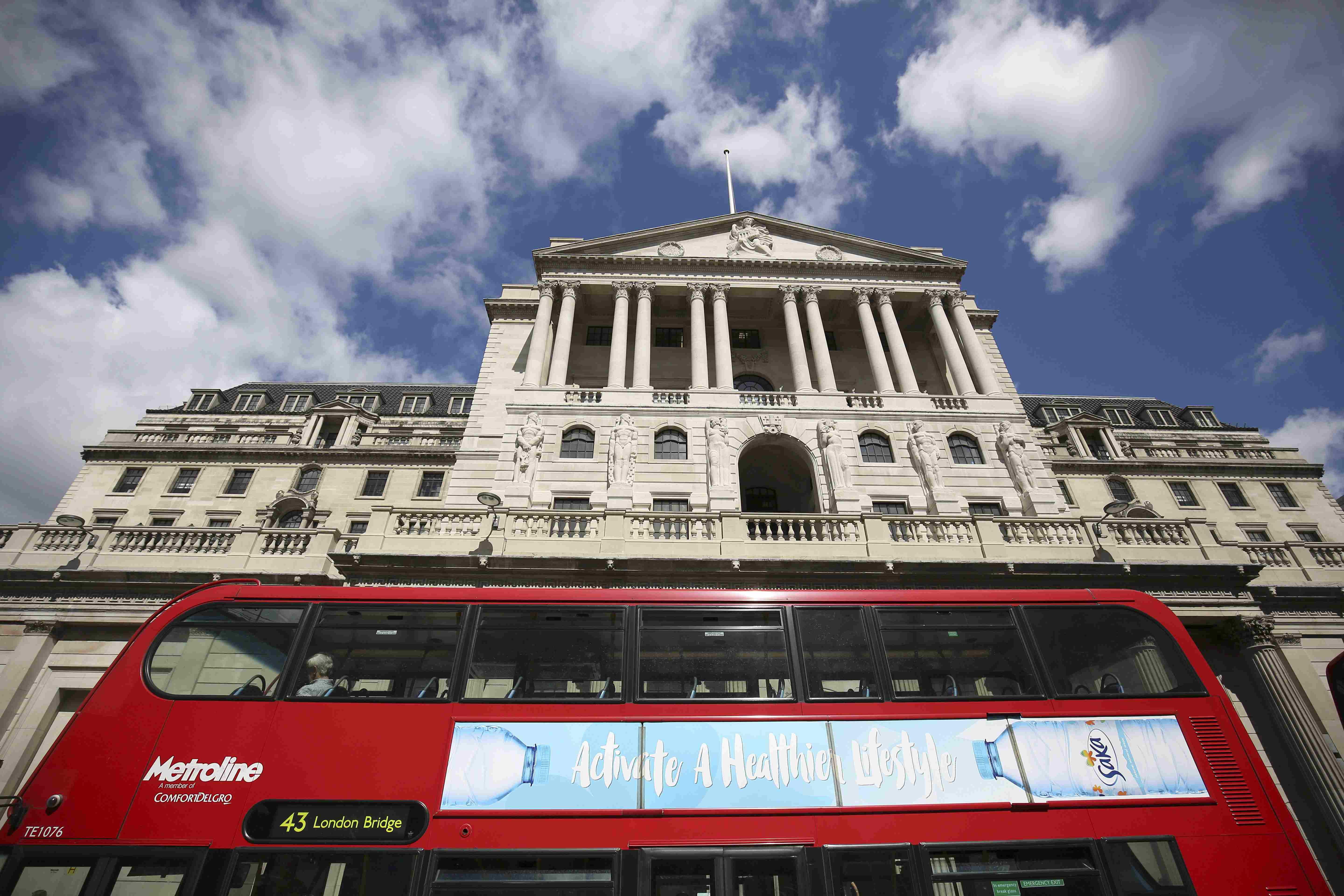 Bank of England cuts rates for first time since 2009, restarts bond purchases