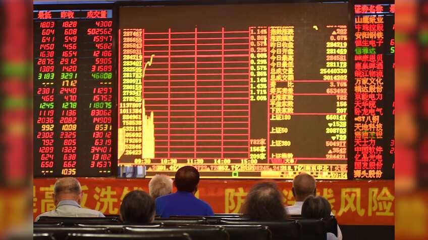 Asian shares near one-year high, dollar slips after weak US data