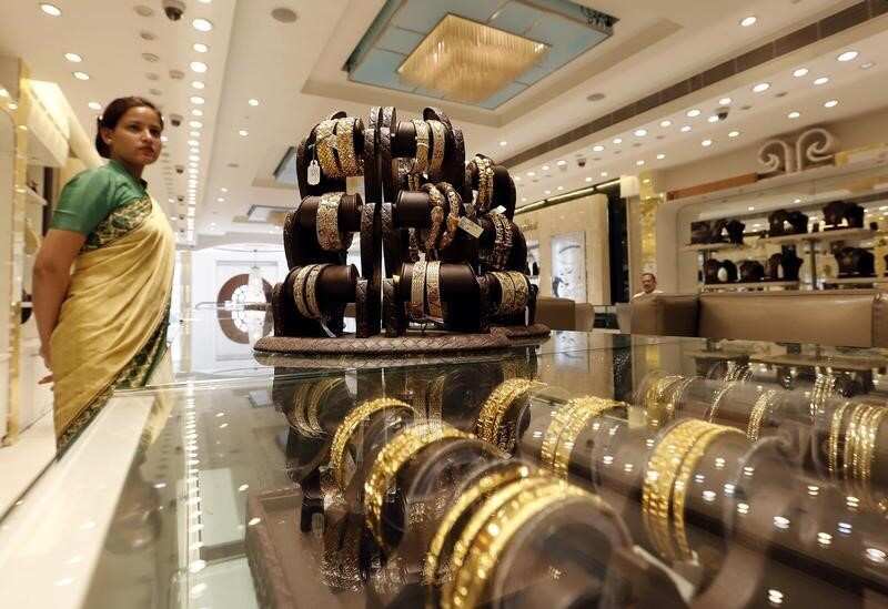 Gold fall over 1% on US Fed rate hike comments 