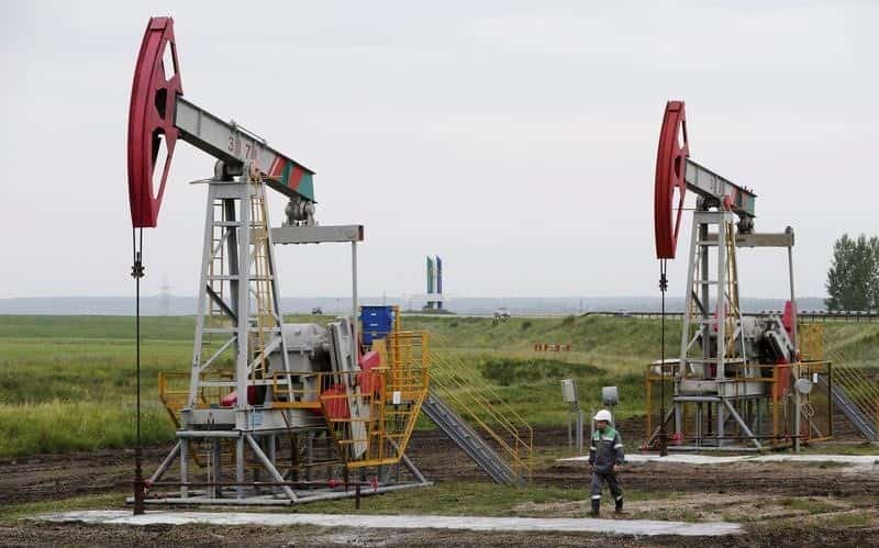 Oil prices dip on surging Iran sales, but looming OPEC deal offers support