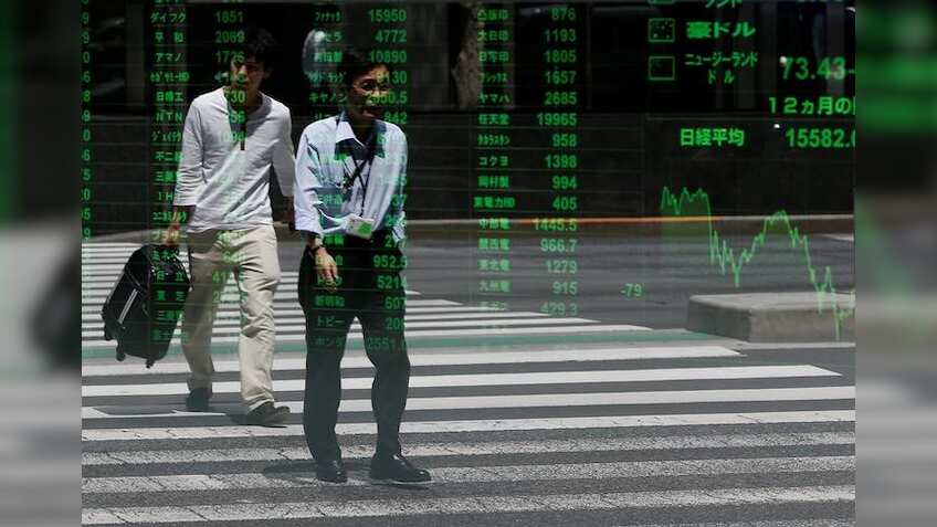 Asian shares firm in countdown to China data