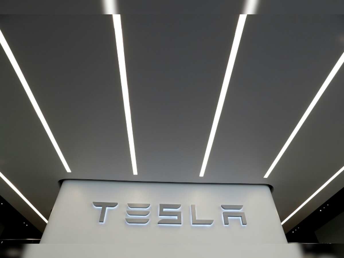 Tesla defends plan to acquire renewable energy firm