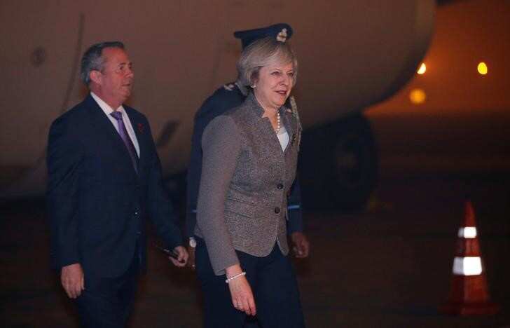Theresa May, in India, says UK to be free trade advocate