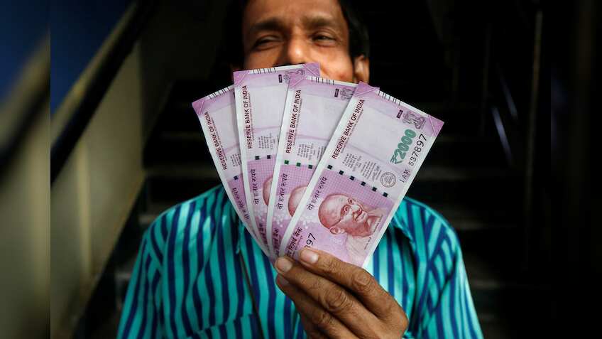 Money-changers make merry as people flock to convert black money