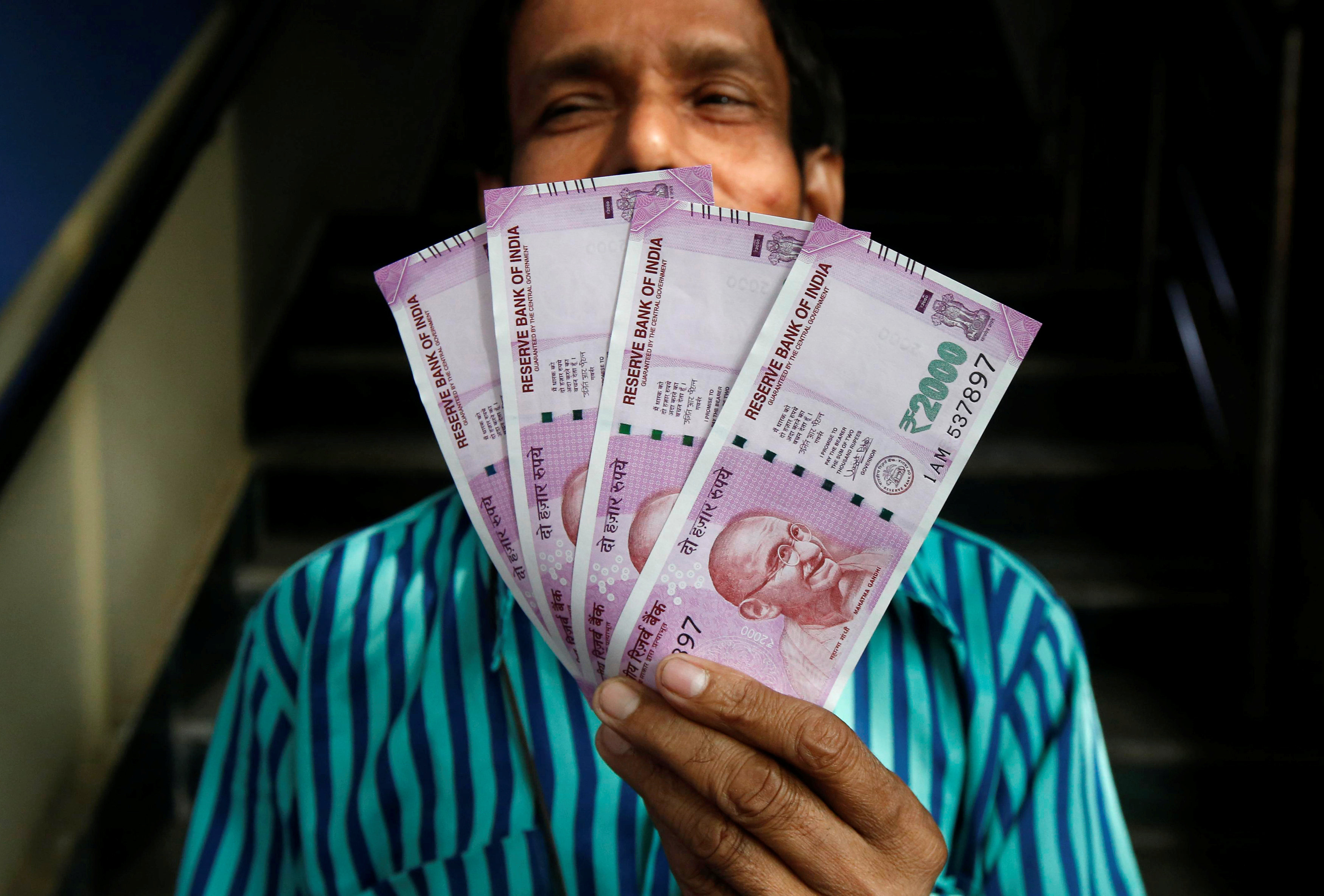 Money-changers make merry as people flock to convert black money