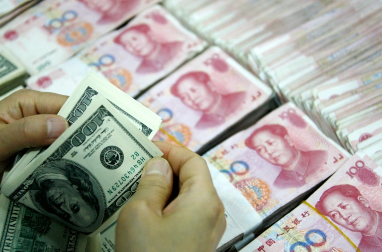 China weakens yuan-dollar rate beyond landmark 6.8 level