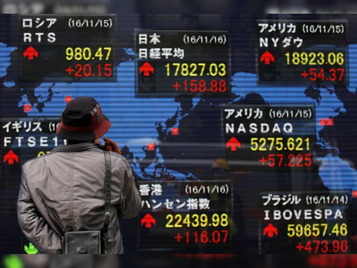 Dollar edges away from 13-year peak, Asian stocks