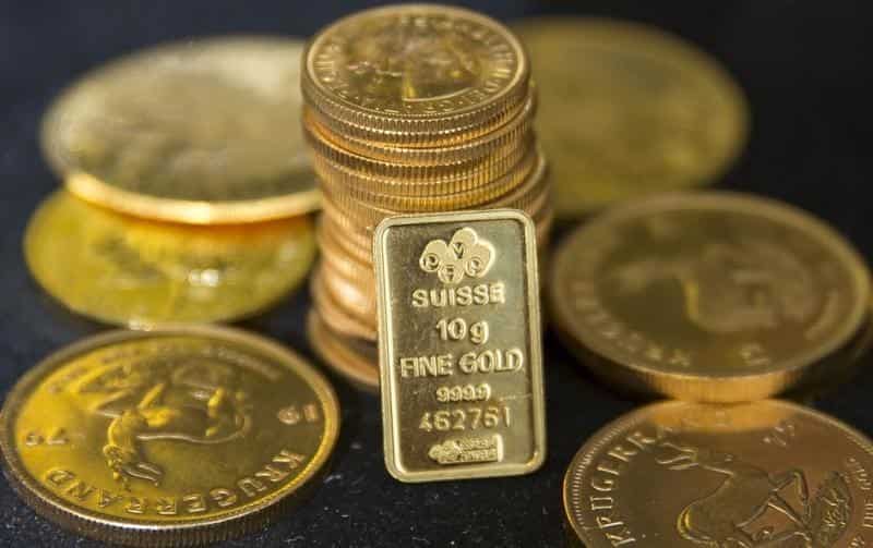 Gold falls to 10-month low on Fed rate hike bets