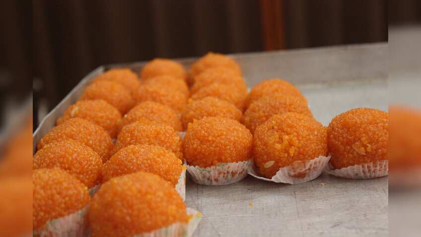 Stand in line at ATMs get a laddoo from BJP govt