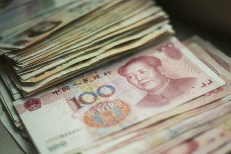 China urges calm on yuan after US rate hike