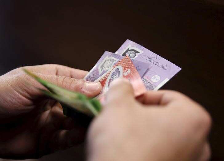 Australia's budget drips with red ink, top credit rating at risk