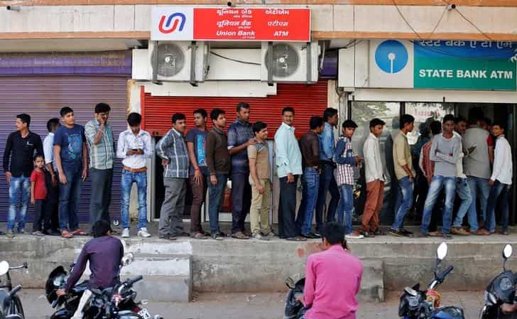 Indians line up at banks to deposit savings or see them disappear on last day of exchange on December 30