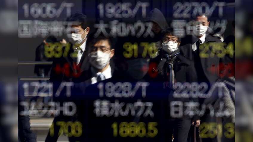 Asian shares off 1 1/2-year high, Trump's yuan comment in focus