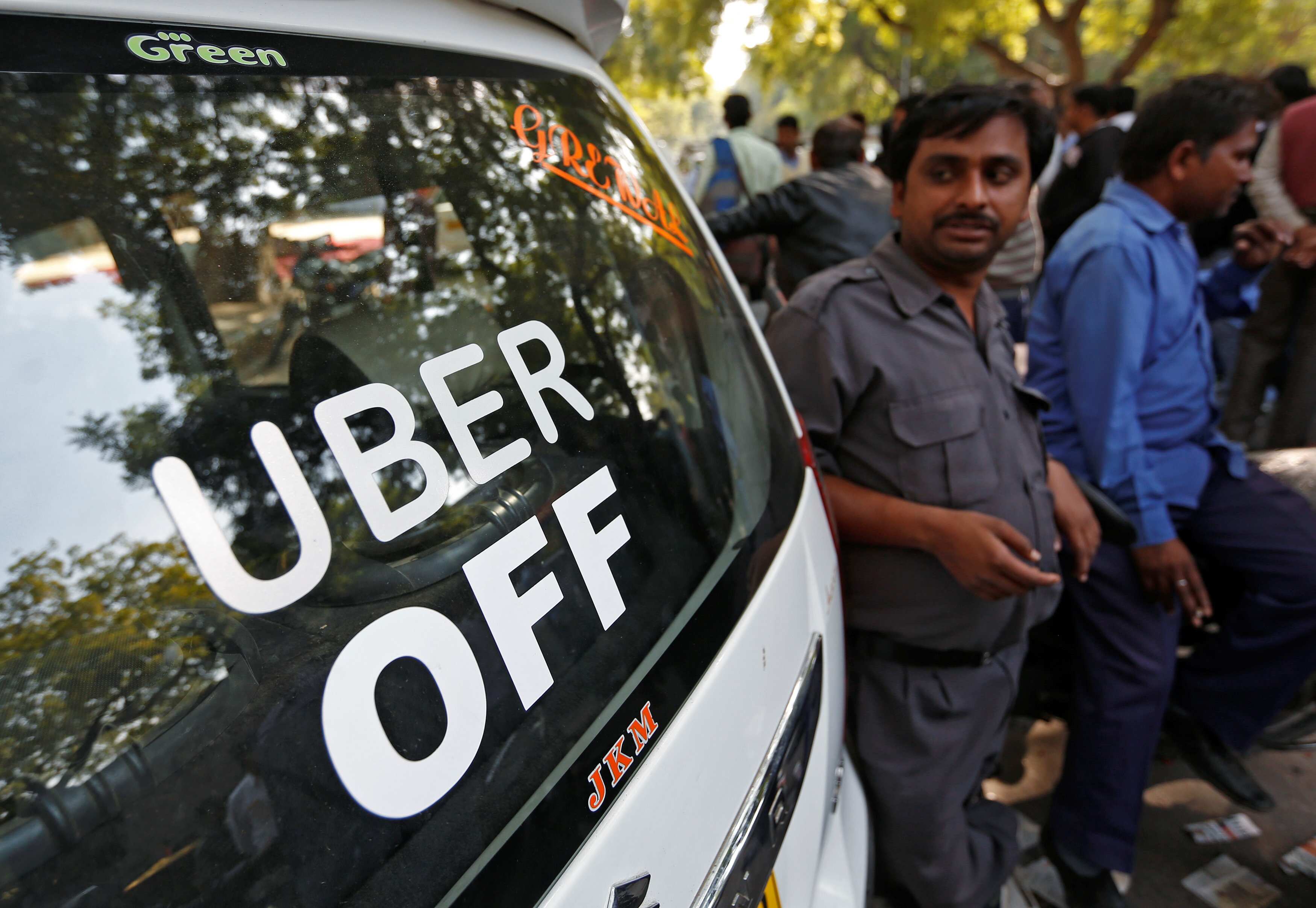 Uber and Ola drivers stand next to their parked vehicle's during a protest in New Delhi, India, February 14, 2017. Credit: Adnan Abidi/Reuters Uber and Ola drivers stand next to their parked vehicle's during a protest in New Delhi, India, February 14, 2017. Credit: Adnan Abidi/Reuters
