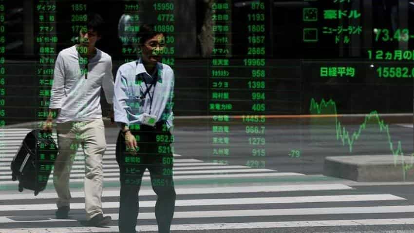Asian shares advance, dollar supported by March rate hike bets
