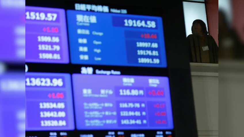 Asia stocks set to end week higher, dollar slides after Fed