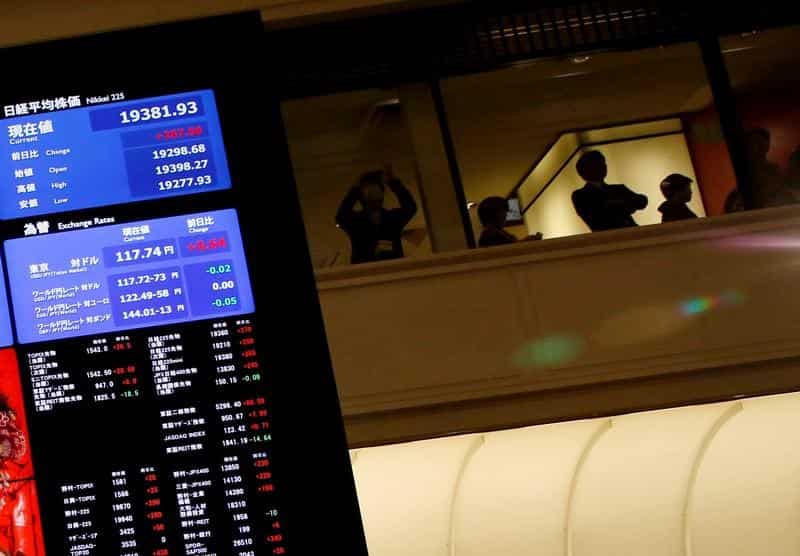 Asian shares near 15-month high, dollar soft on less hawkish Fed
