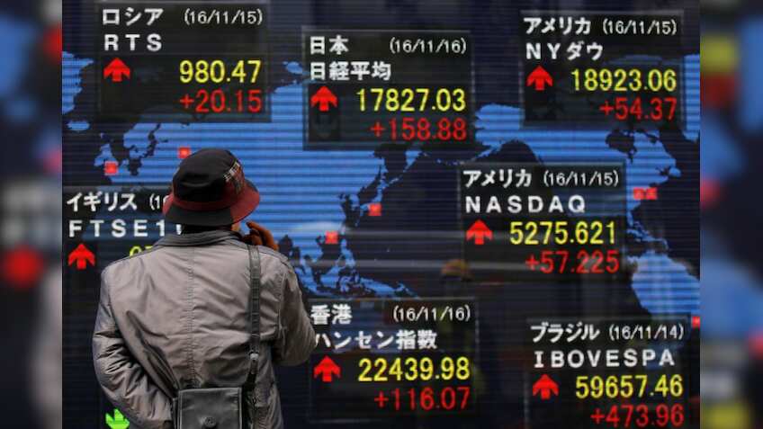 Asia stocks ride global momentum, dollar up on June Fed rate hike bets