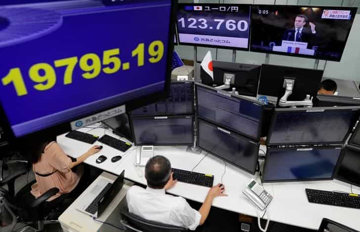 Asian shares, yuan down after Moody's downgrades China