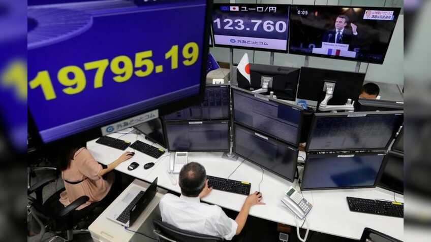 Asian shares, yuan down after Moody's downgrades China