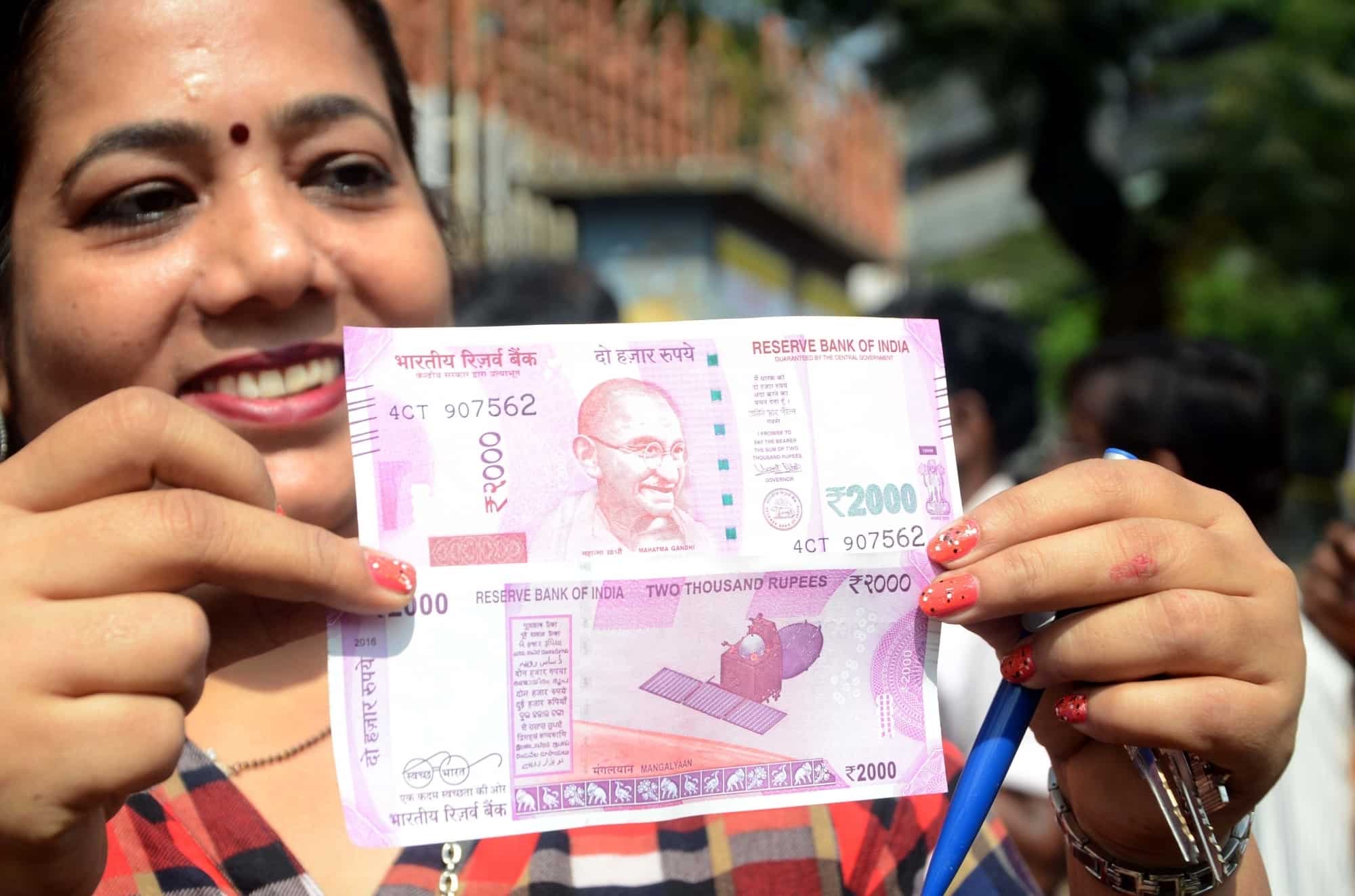 Rupee to weaken in near term;to end 2017 at around Rs 66/USD