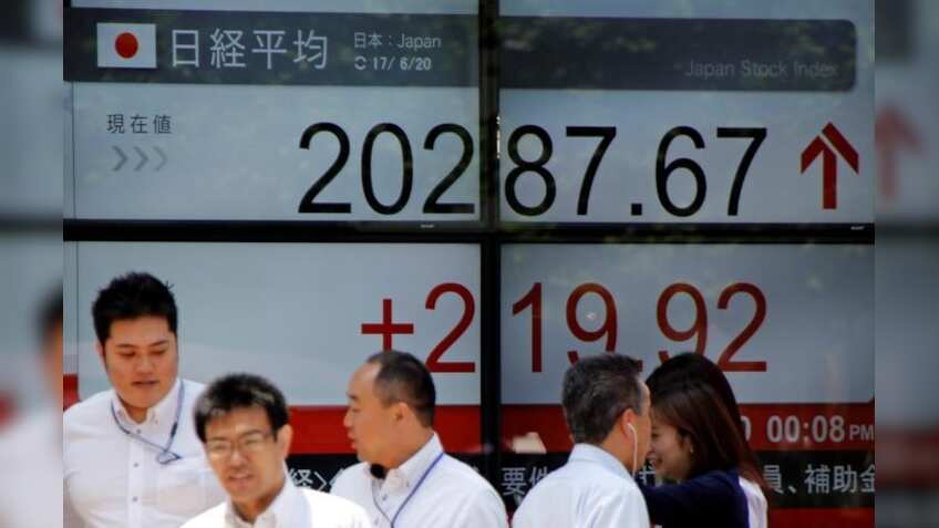 Asian shares dip on profit-taking after Dow hits 22,000
