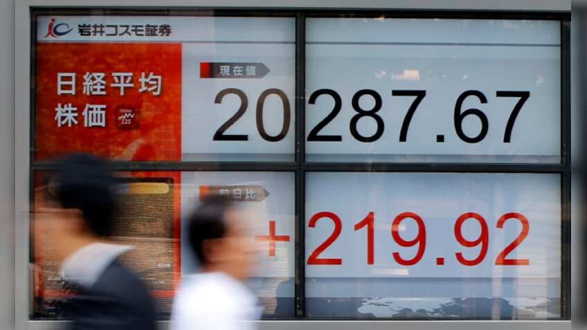 Asian shares edge up, bolstered by modest gains on Wall Street