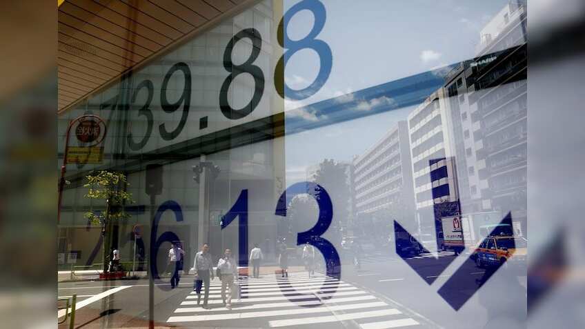 Asian markets wobble as investors await US Fed meeting for rate clues