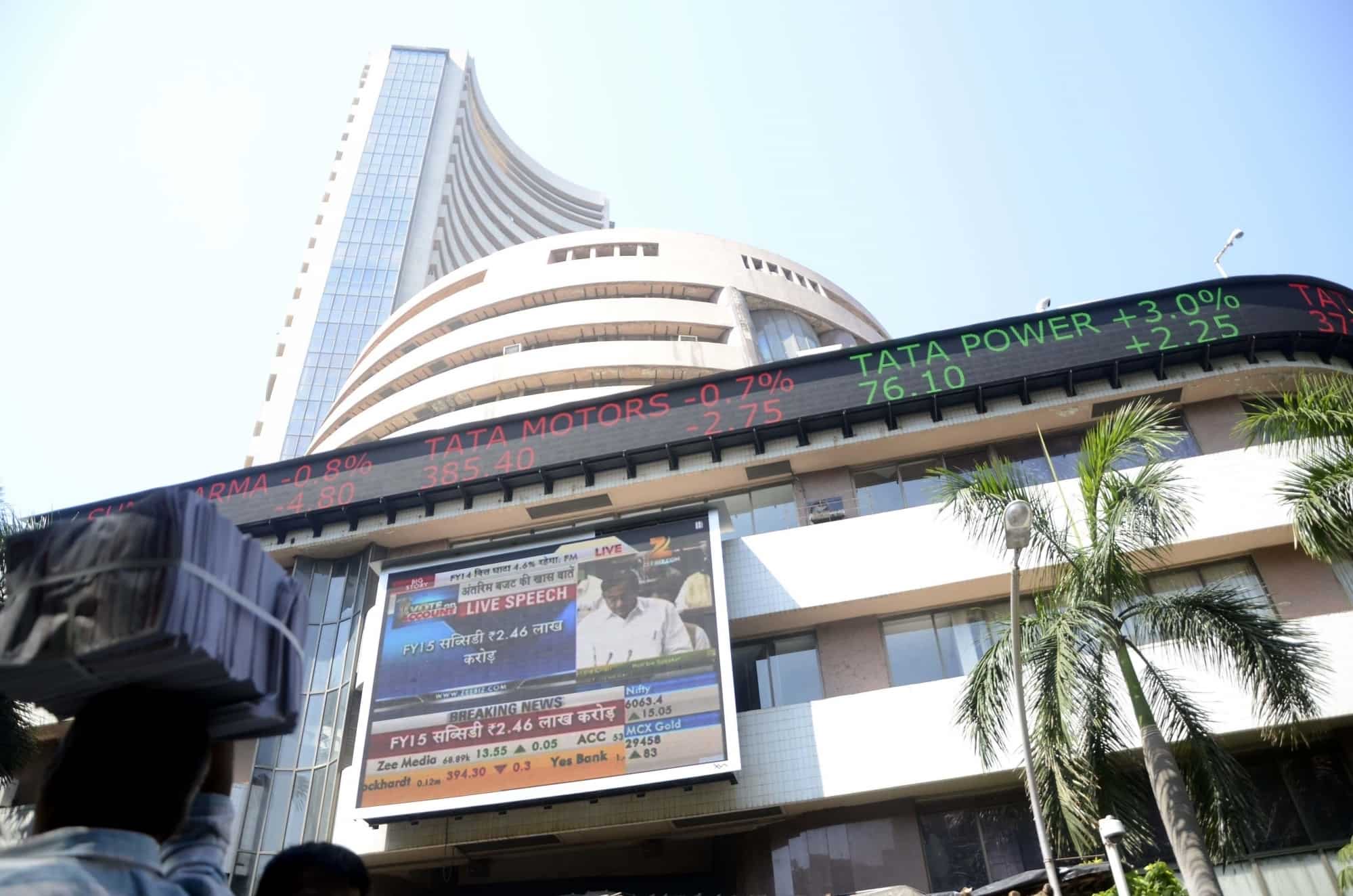Markets close flat as investors show caution