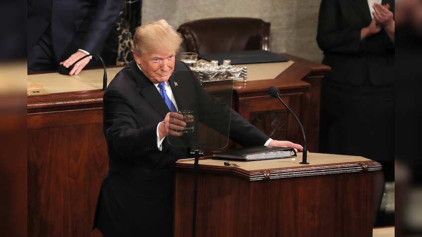 After year of bitter feuds, Trump urges bipartisan cooperation