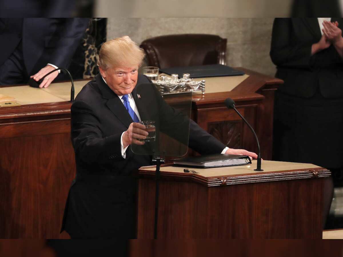 After year of bitter feuds, Trump urges bipartisan