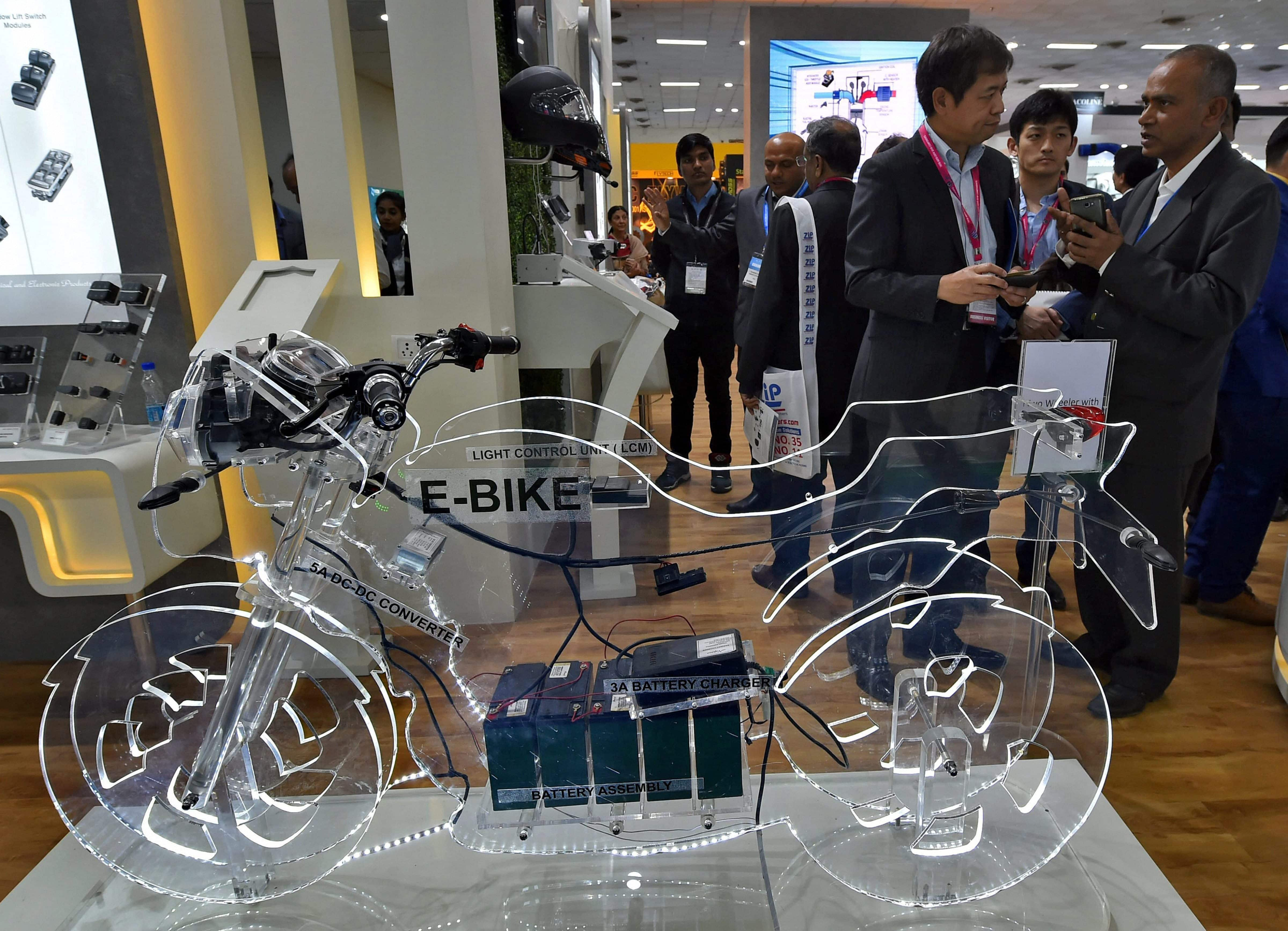 Delegates at a stall at the Auto Expo Component 2018 that began at Pragati Maidan in New Delhi on Thursday. PTI