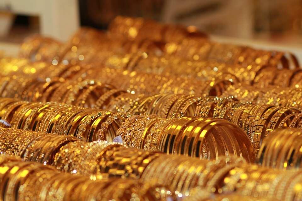 Yellow metal price tumbles in India; Spot gold edges up