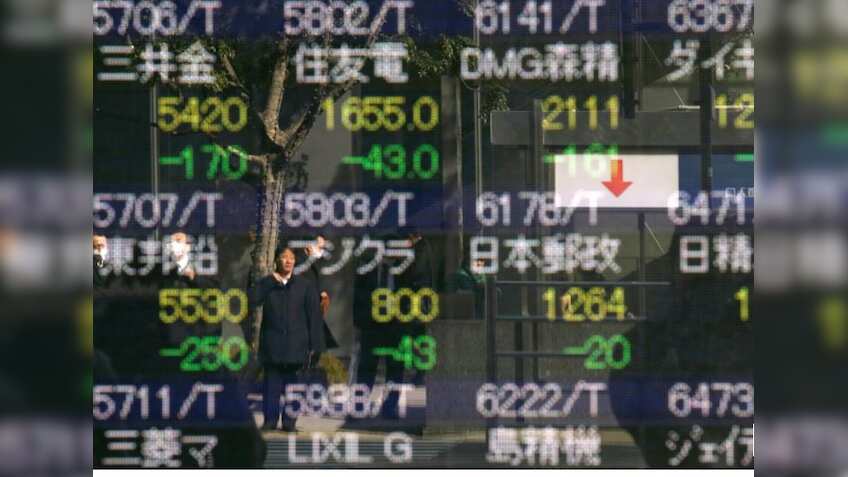 Asian markets step back as investors brace for US Fed outcome