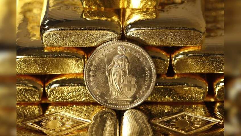 Gold prices recover from 6-month low as dollar drops; Russia buys bullion