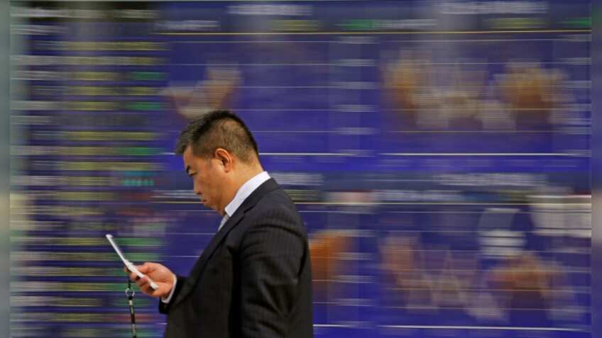 Asian shares, yuan on shaky ground on specter of Sino-US trade war